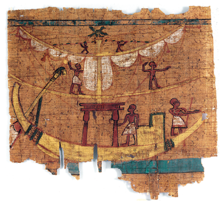 Imagem: Fotografia. Uma folha de cor bege com ilustração de pessoas dentro de uma embarcação de cor amarelo-claro, com duas pessoas dentro, à direita, de pele morena e saiote em branco, com uma estrutura em marrom-escuro, com formato de arco quadrado. Na parte superior, perto das velas brancas, dois outros homens e no alto, outros dois de tamanhos menores. Todos são morenos, um com saiote branco e outros sem.  Fim da imagem.