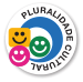 Imagem: Ícone: Pluralidade cultural, composto pela ilustração de três rostos sorridentes e coloridos. À direita, um arco azul. Fim da imagem.