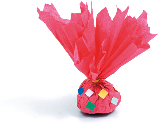 Imagem: Fotografia. Peteca de papel vermelho com pequenas colagens de papéis coloridos. Fim da imagem.