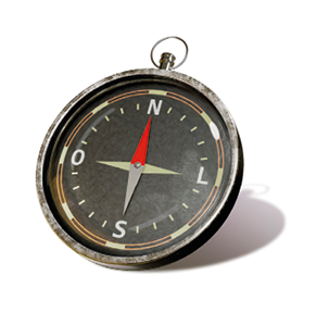 Imagem: Fotografia. Bússola circular preta indicando norte, sul, leste e oeste. Fim da imagem.
