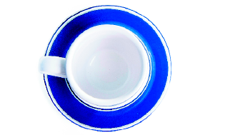 Imagem: Fotografia. Uma xícara vista de cima.  Fim da imagem.