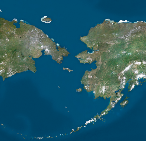 Imagem: Fotografia. Destaque de duas porções continentais próximas e margeadas por água.  Fim da imagem.